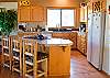 Kitchen opens up into the Living room and Dining room.