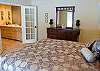 Another view of the King Master Suite with a view of the master bathroom.