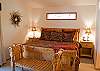 The master bedroom includes a king size bed that is complete with a luxurious set of bedding.  This room has a walk-in-closet and a master bathroom.