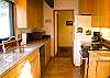 Granite counter tops, updated appliances and hard wood floors make preparing a meal in this kitchen absolutely delightful!