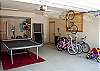 Ping Pong table in garage with plenty of bikes!