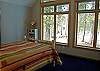 Another view of  Queen Size Bed.  A wall of windows will let in the sunshine.