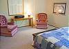 Another view of the Queen Master Suite with a comfortable spot to read.