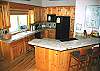 Breakfast bar with stools makes for more seating.