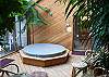 This hot tub room has sliding glass doors to the outdoor patio which makes this the ideal hot tub for any season.