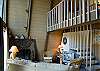 Imagine the great times to be had in this warmly decorated great room!  The space is complete with cozy furniture, high ceilings, and a wood burning fireplace! Escape from the weather to this cozy living room.