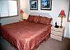 The master bedroom features a king size bed, TV, DVD and stereo.   It has its own master bathroom with a shower.  This bedroom is to the right of the living room.