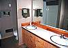 This Downstairs Bathroom has double sinks.