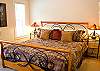 Not far to go to this King bedroom as it is located right off of the livingroom.  It also has a door to the deck and also has a separate door to the main bathroom downstairs.