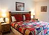 Darling second King Bedroom. This   bedroom features a walk-in closet and adjoining bathroom.