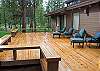 View of the back patio. Lots of deck space and seats for everyone to enjoy.