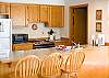 Kitchen that opens to dining and living areas.