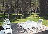 Back Patio. Lots of grass for the kids to play and great place to lounge in the sun.
