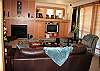 Living Room with flat screen tv and gas fireplace.