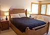 Downstairs Master Queen Bedroom is left of the entry. This room has a door to the outside hot tub and a flat screen TV.