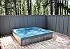 After a long day of outdoor activities enjoy some  relaxing time out on the large deck under the stars in this fully jetted hot tub.