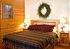 Upstairs Right Wing King Master Bedroom with a walk in closet, shower, and jacuzzi tub.