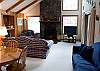 Cedar accents, vaulted ceilings, skylights, and the large floor to ceiling stone fireplace add to the ambience and peacefullness of this centrally located home.