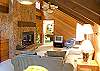 A family room upstairs provides another gathering space for fun and games.  A card table, wet bar, wood burning fireplace, and sitting area are provided.