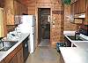 A completely equipped kitchen is organized for easy preparation of family meals.
