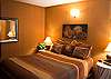 This home includes a bedroom downstairs that feautures a Queen Size Bed.  It shares a bathroom located right next door in the hallway.