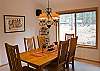 The Kitchen and Dining Room connect to make serving and eating meals a breeze.  Lots of windows to make your meals a pleasant bright experience.  Back door to deck with a view of a beautiful rocky hill.