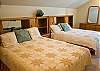 Upstairs Queen Bedroom.  This room has two Queen Beds with a walk-in closet.  This has a private hall bathroom with 2 sinks and a tub/shower.