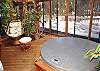 It's like being in two places at once. You have a jungle feeling, but there also could be snow on the ground. Enjoy the weather as well with the sliding glass doors to make your stay that much better.