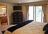 Upstairs Master Bedroom with King Bed and a private balcony! Flat screen TV.