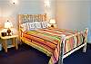 Nice and Private Master Queen Bedroom set down a hallway to the back of the house.  There is a TV.  Bath has shower.