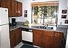 Light and bright fully equipped kitchen.