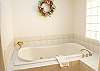 This home has 3 spacious bathrooms.  This is the downstairs master bathroom, complete with a large jacuzzi tub.