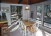 Lots of windows to let the outdoor in and plenty of room at the table.