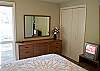Cozy Queen Bedroom Downstair with a TV.