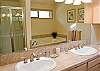 Master Bathroom with double sinks, jacuzzi tub and shower.