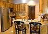 Tile countertops and pine cabinetry make this a gorgeous kitchen. It is stocked with many culinary tools and gadgets that will assist you in creating a feast.