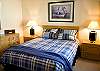 This 2nd bedroom downstairs features a Queen Size Bed. It shares the hall bathroom with a tub/shower.