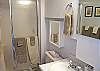 The bathroom has a shower.