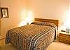 This is the 2nd Master Bedroom with a Queen Size Bed.