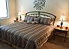 This comfortable King Bedroom shares a jack and jill bathroom.