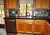 Beautiful cabinets and slate flooring in the kitchen.  With sliding door to back deck.
