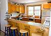 The breakfast bar has seating for four. The open kitchen makes it easy to entertain in the dining room.