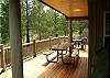 Large deck with hot tub.