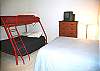 Pyramid Bunk and Queen Bed with small TV/VHS.  Has access through bedroom to bath with tub/shower.