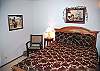 Downstairs Queen Bedroom has access to the hall bathroom with tub/shower. This room has TV, DVD and VHS.