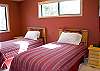 Twin Bedroom downstairs with access to the third bathroom.