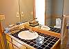 Downstairs Master Bathroom with a shower and outside access to the hot tub.