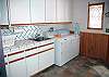 A full size washer and dryer are provided for your convenience.  The mudroom also has a ironing board, changing benches and 12 oversize hooks for ski, fishing , and biking clothes and accessories.