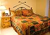 This bedroom is one of three master suites featured in this home.  High quality bedding will guarantee you a great night's sleep.