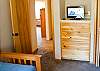 Another view of twin bedroom with flat screen TV.